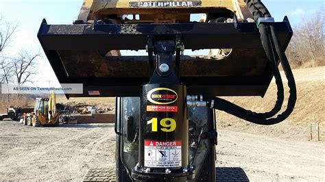 caterpillar skid steer post hole digger|cat skid steer attachments.